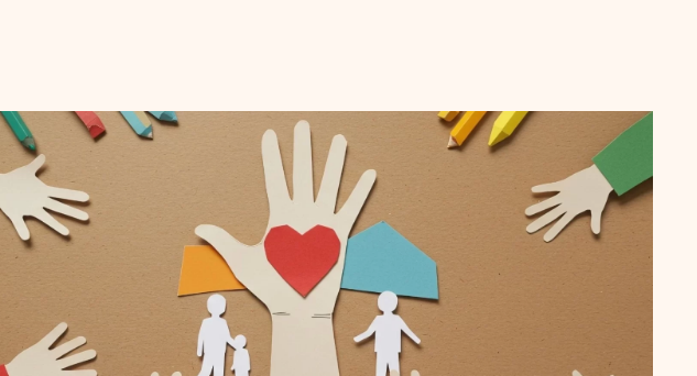 Paper-craft hands cradling a heart and a family